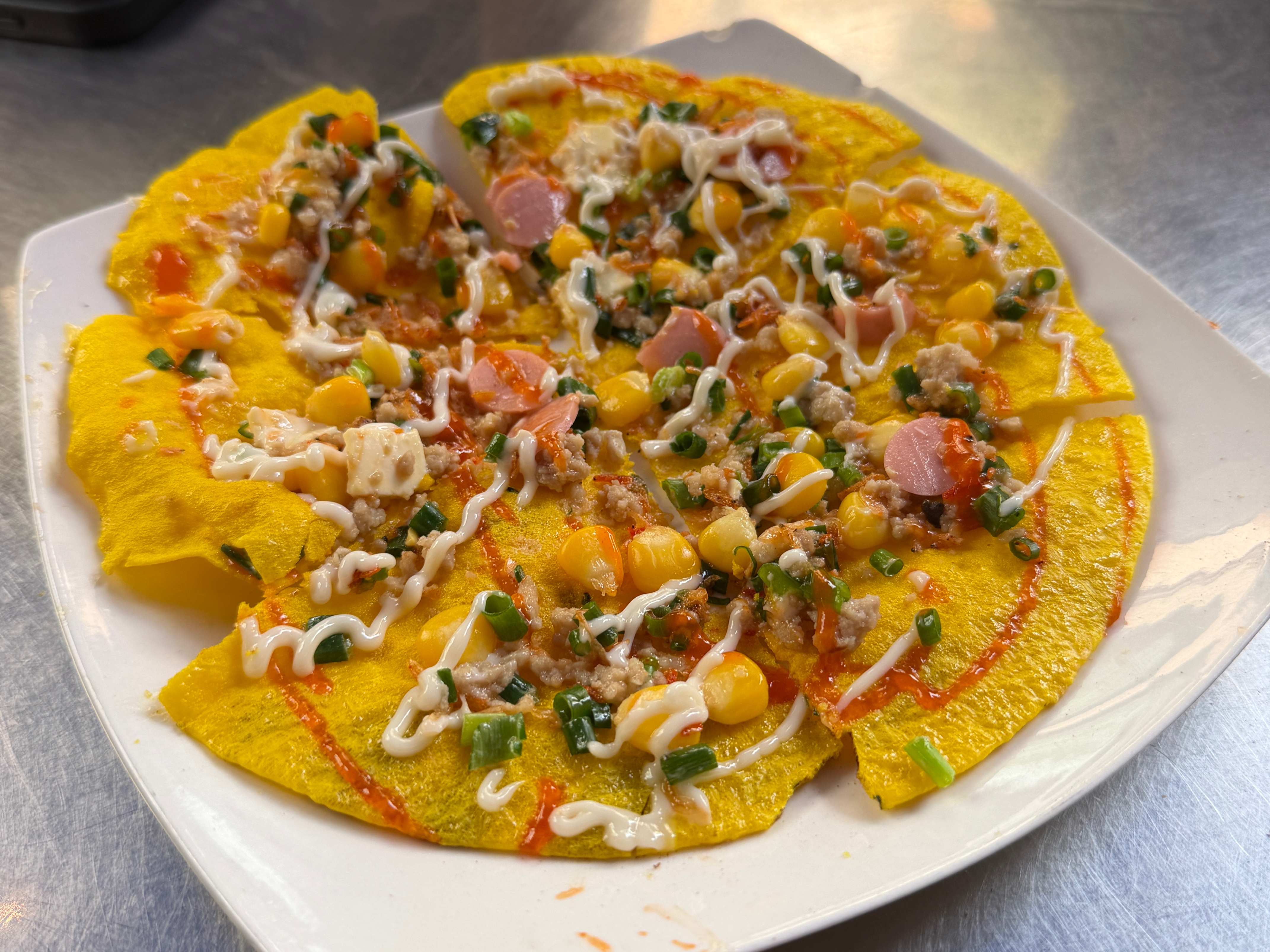 Vietnamese pizza from a street food stall in Ho Chi Minh City