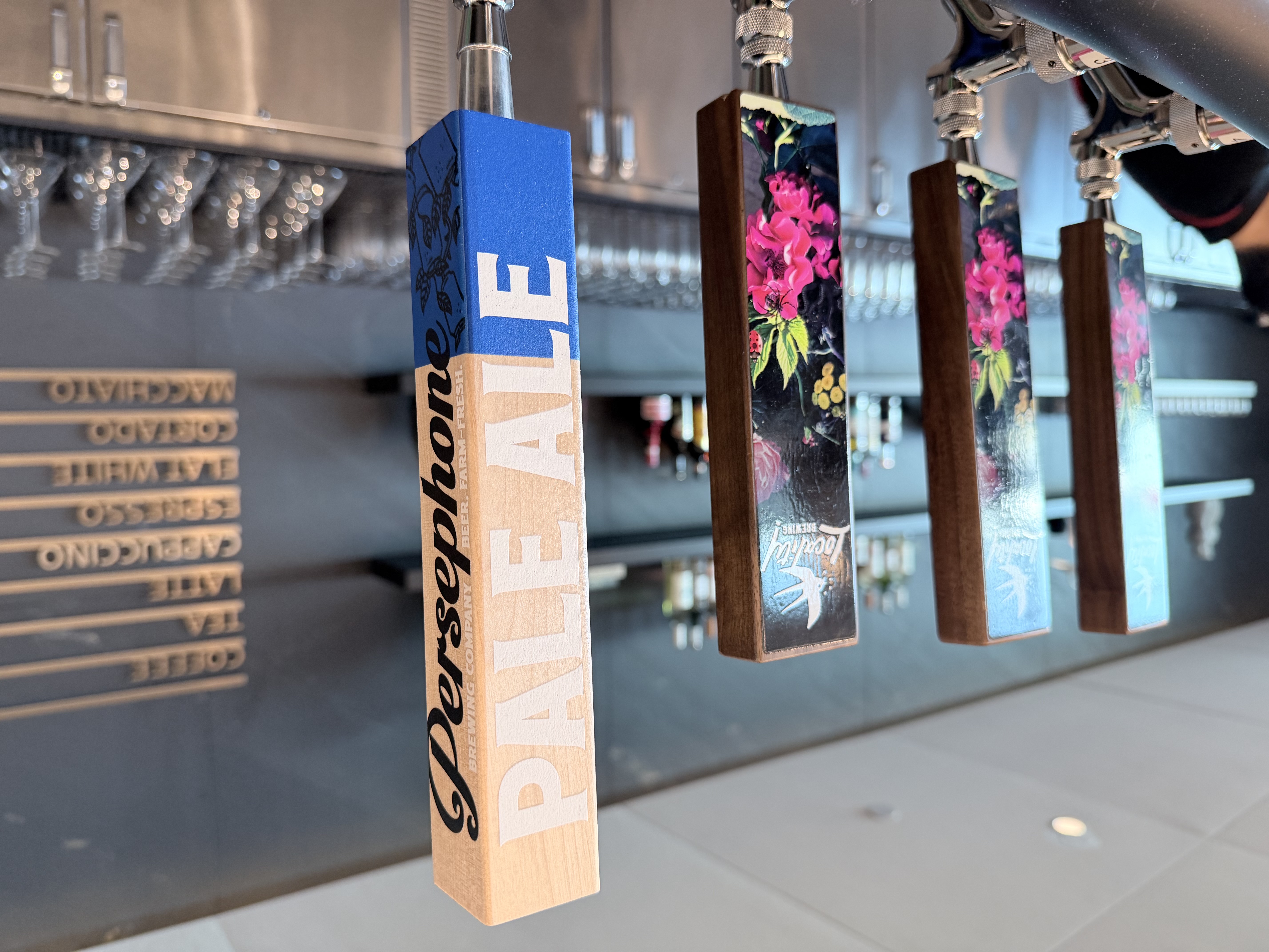 Persephone Brewing tap handles at the Air Canada Café YVR bar