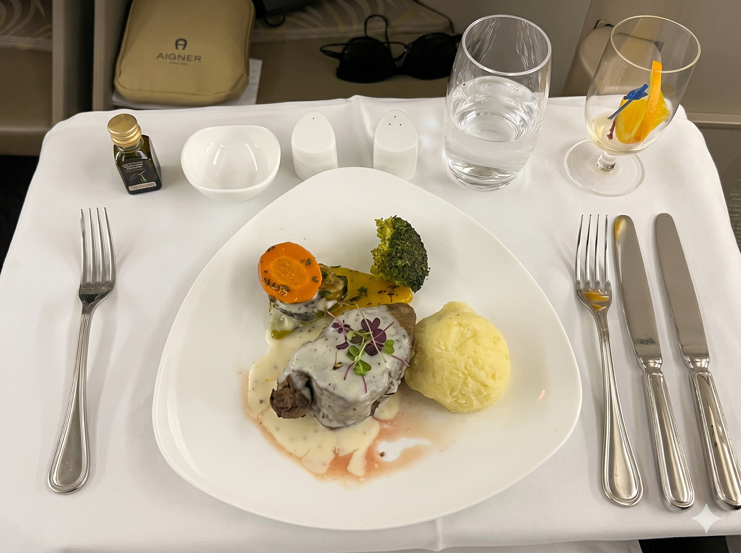 Asiana Airlines business class main course with beef, potato puree, broccoli, and carrots