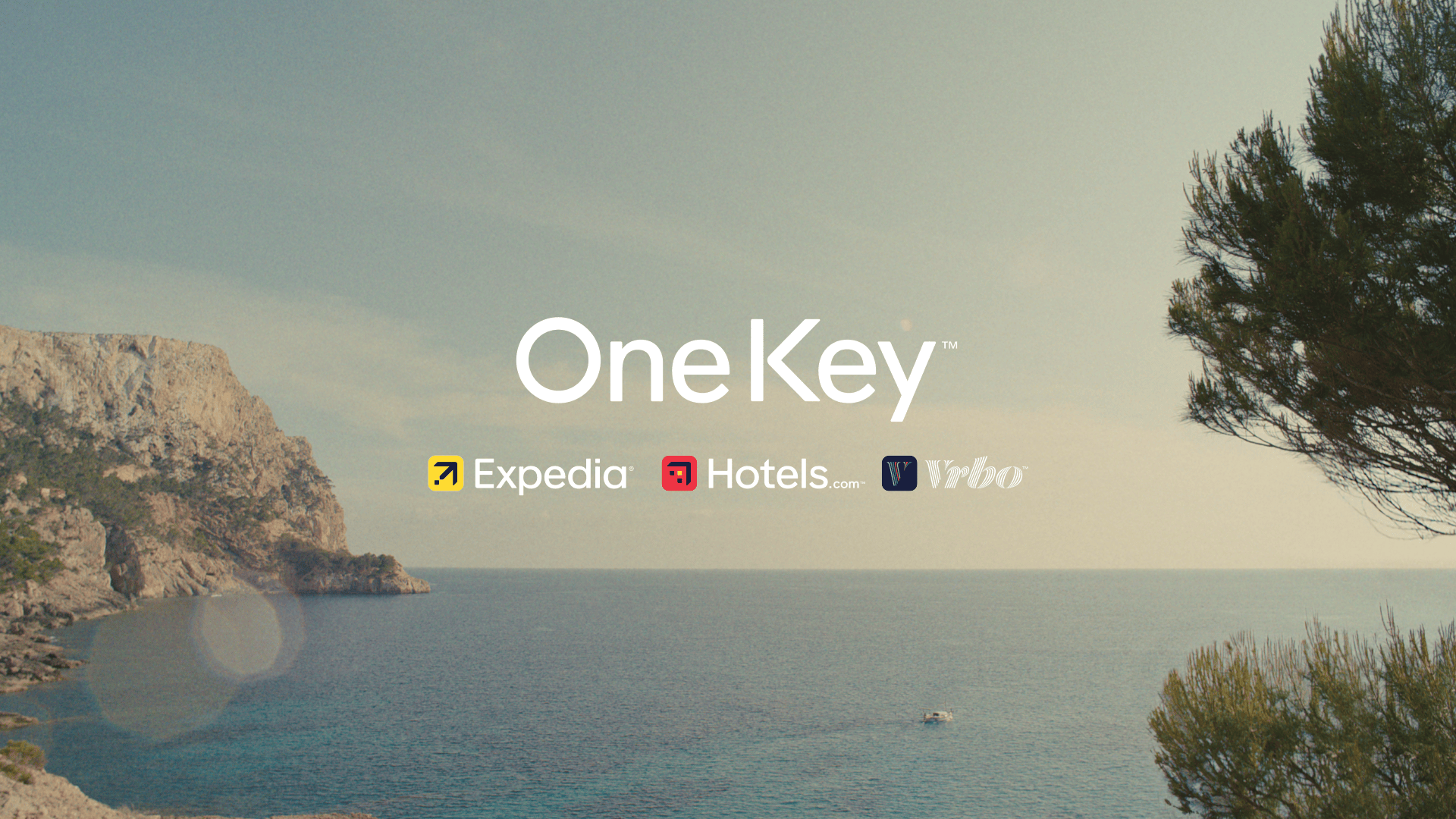 One Key branding with the Expedia, Hotels.com, and Vrbo logos
