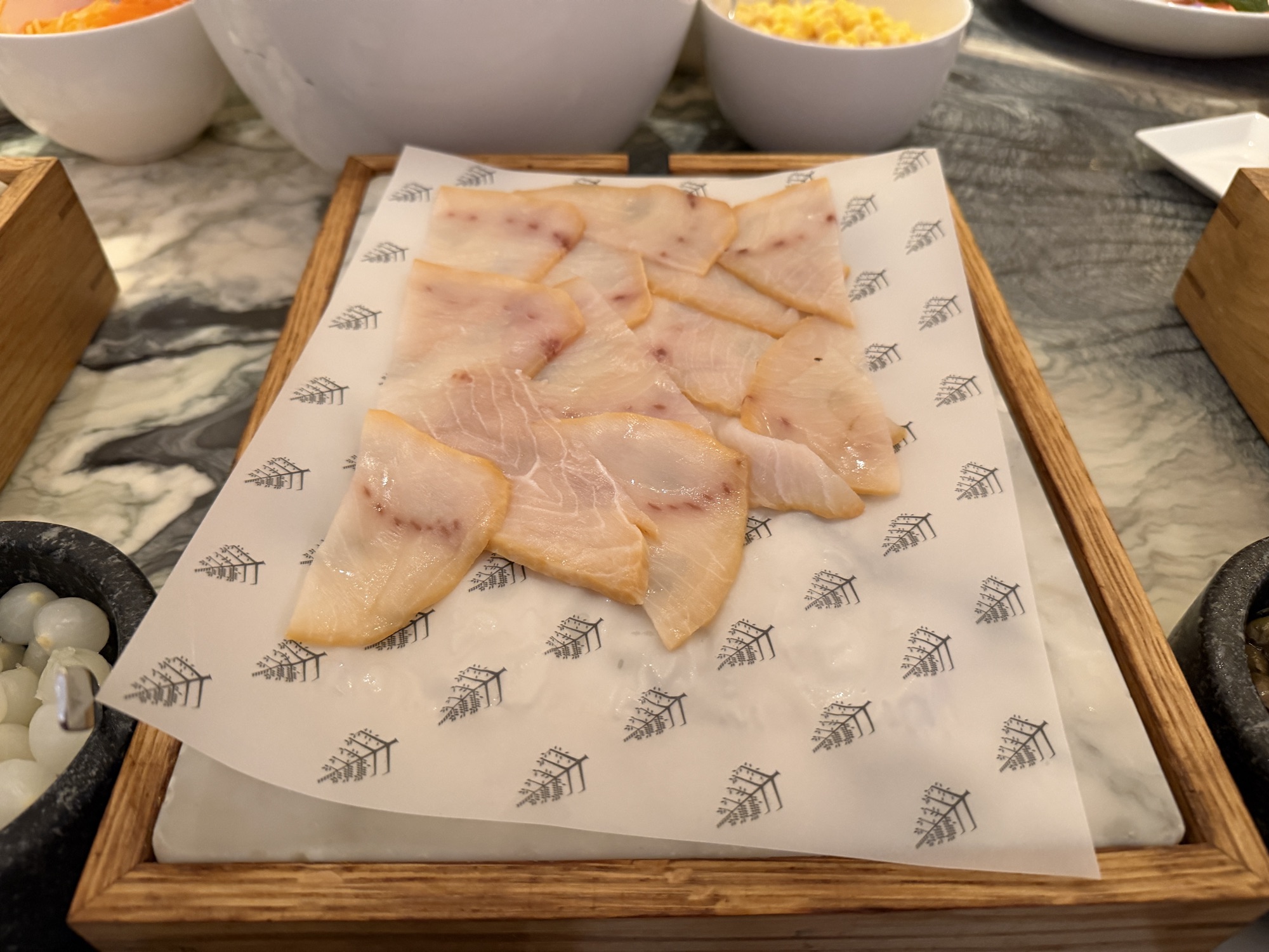 Cured fish slices at the Riva del Fiume cold station at Four Seasons Hotel Bangkok at Chao Phraya River