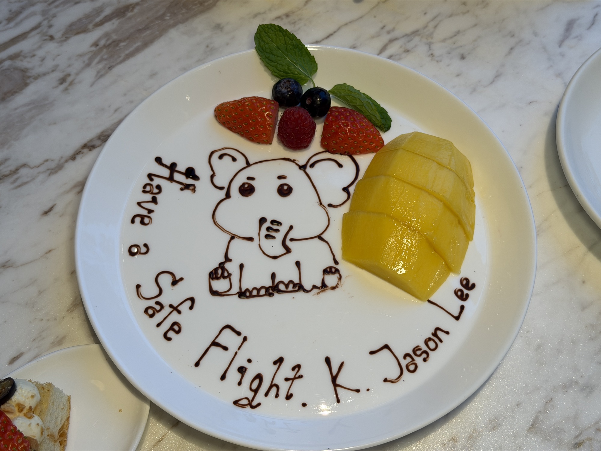 Personalized plate reading Have a Safe Flight with a hand-drawn elephant at Four Seasons Hotel Bangkok at Chao Phraya River