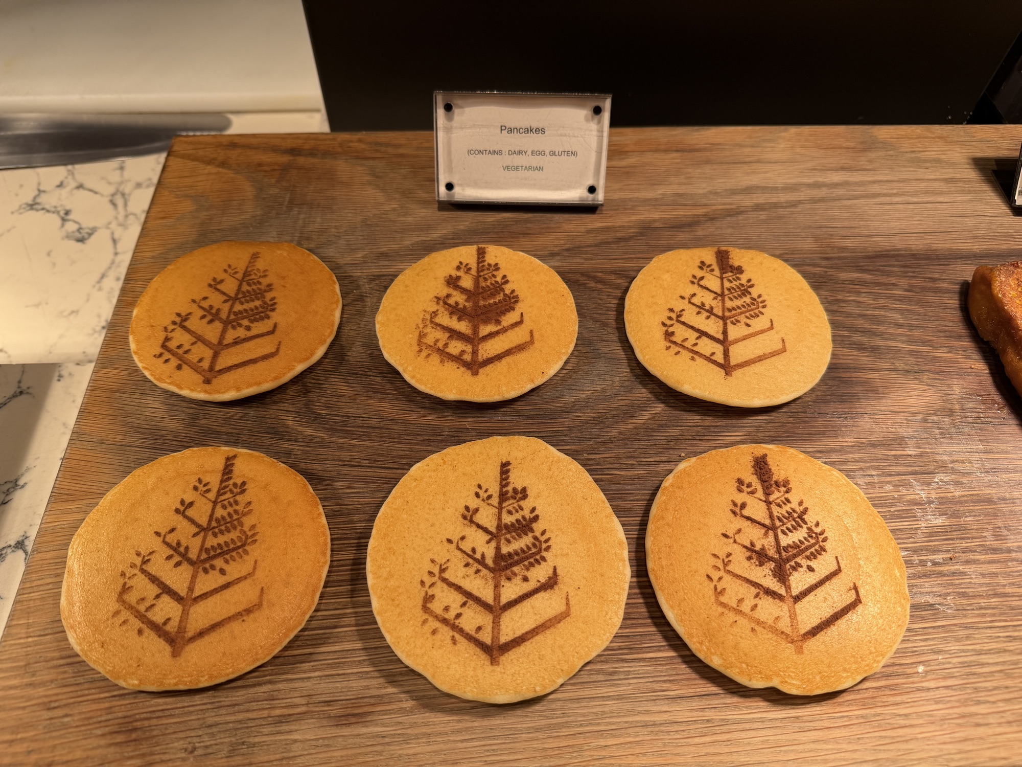 Pancakes stamped with the Four Seasons tree at Four Seasons Hotel Bangkok at Chao Phraya River
