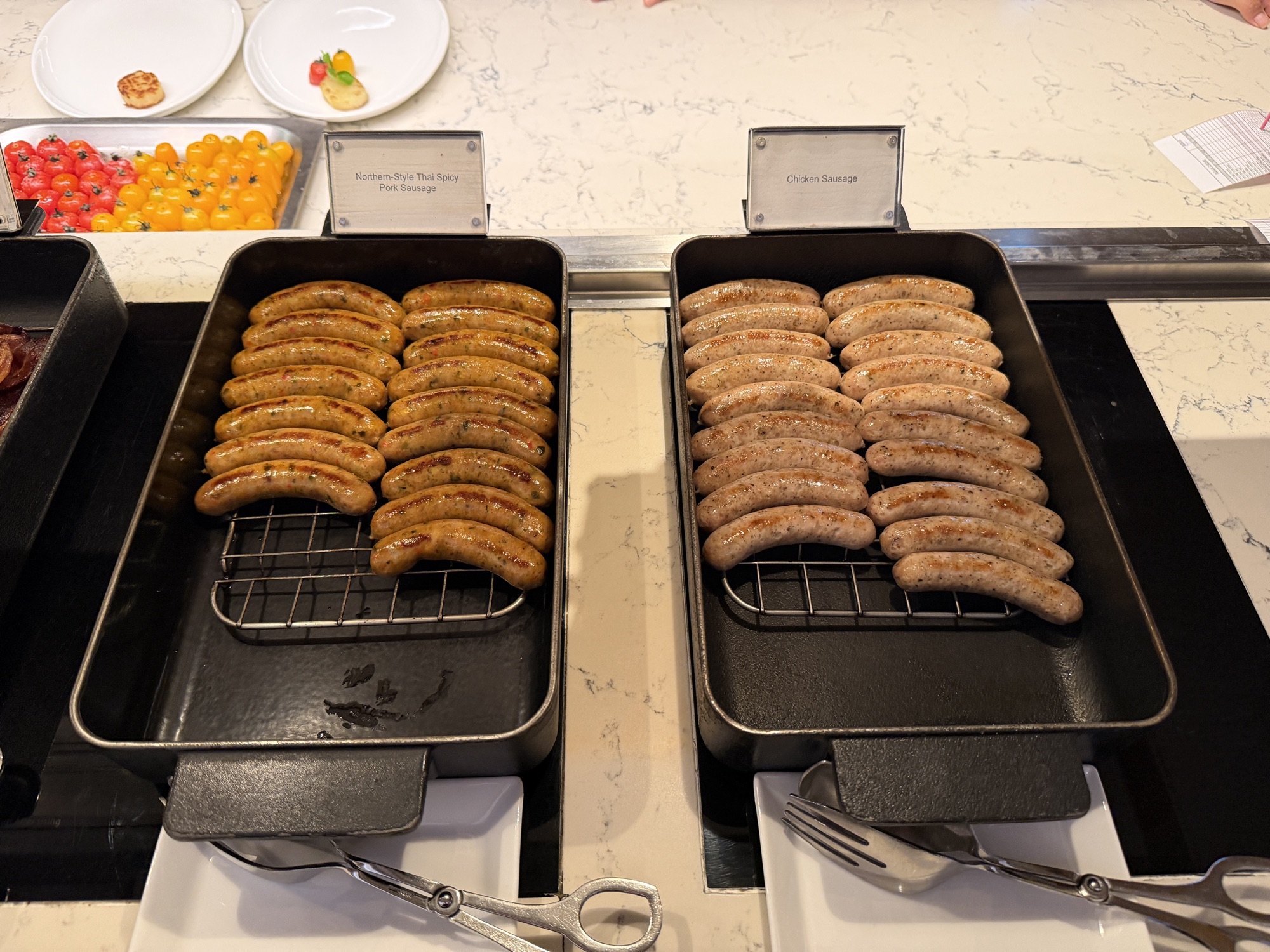Chicken and pork sausages at the Riva del Fiume hot line at Four Seasons Hotel Bangkok at Chao Phraya River