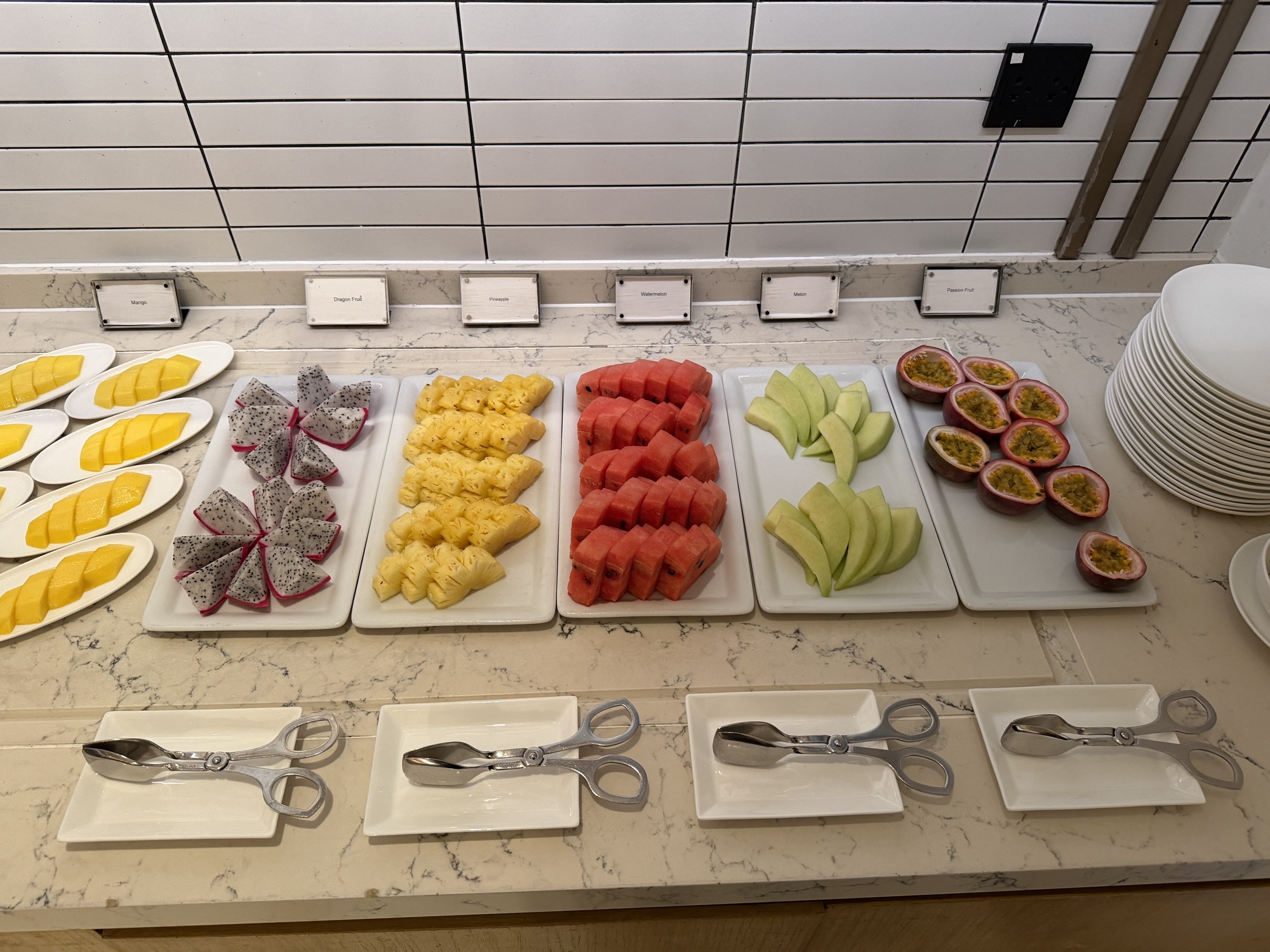 Sliced tropical fruit including mango and dragon fruit at Four Seasons Hotel Bangkok at Chao Phraya River