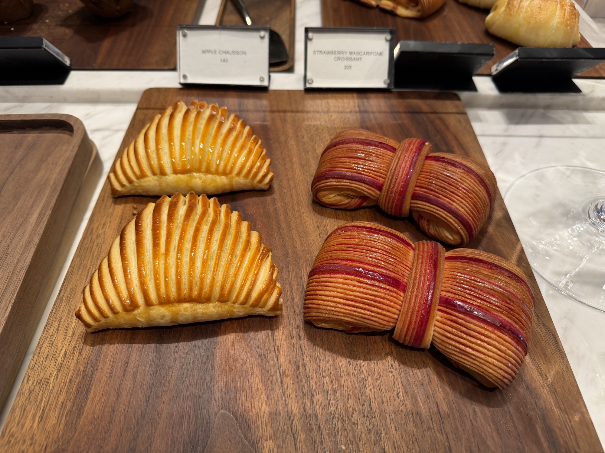 Pastry display case at Café Madeleine at Four Seasons Hotel Bangkok at Chao Phraya River