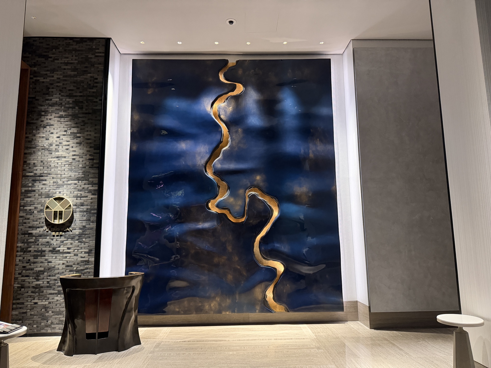 Gold-and-lapis abstract art installation in the lobby at Four Seasons Hotel Bangkok at Chao Phraya River