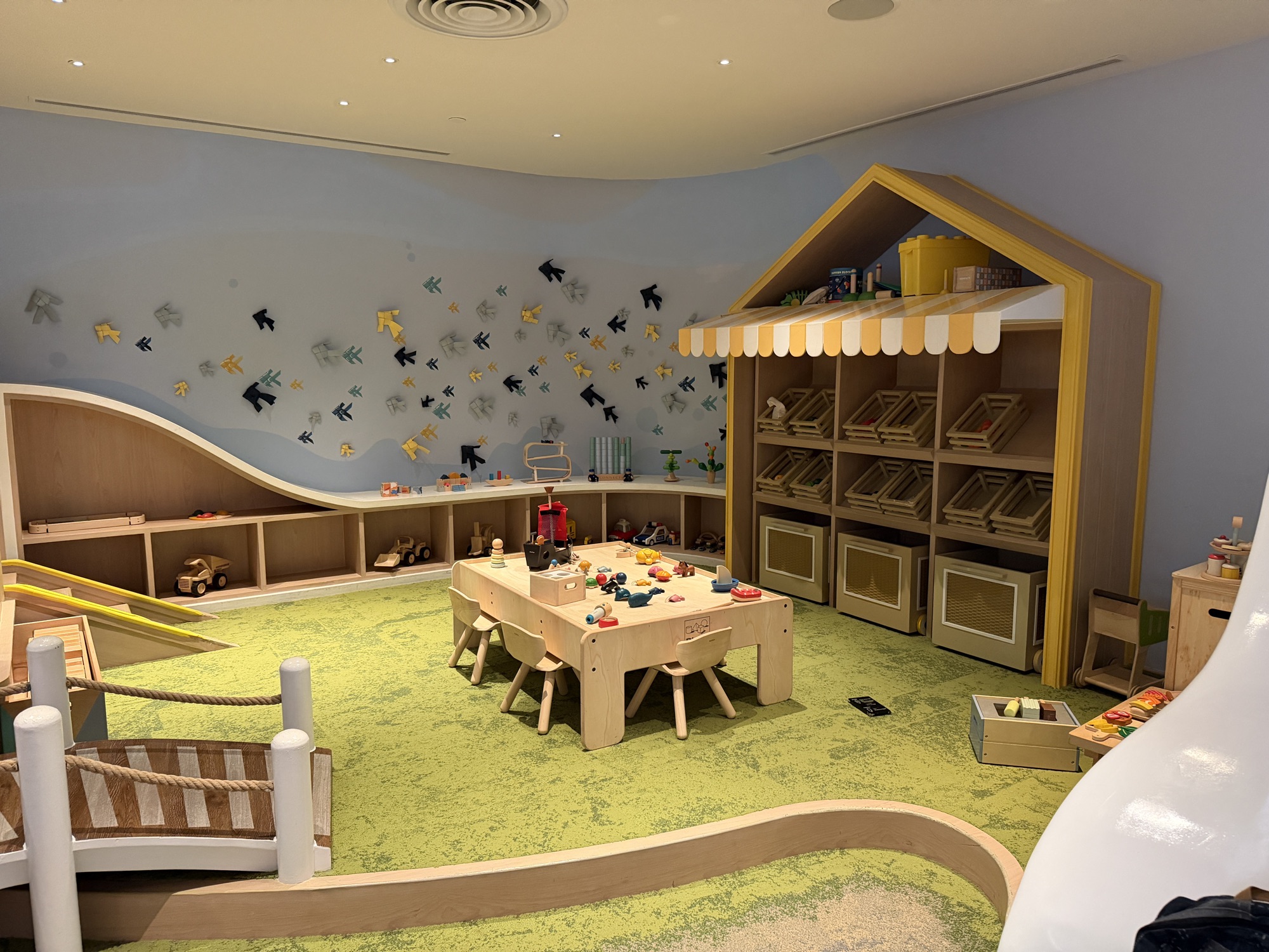 Playroom of the Kids for All Seasons club with slide, rope bridge, and toys at Four Seasons Hotel Bangkok at Chao Phraya River
