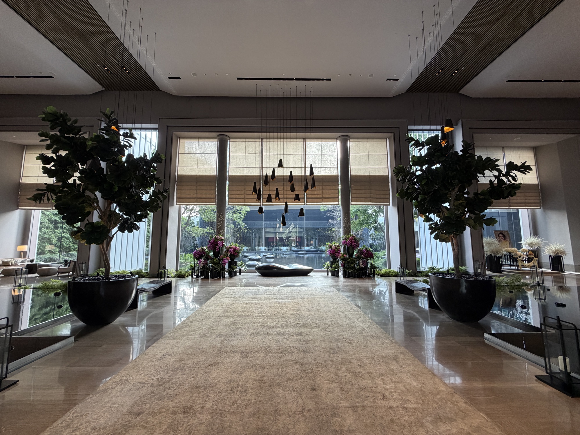 The lobby runs on a grand central axis toward the courtyard. at Four Seasons Hotel Bangkok at Chao Phraya River