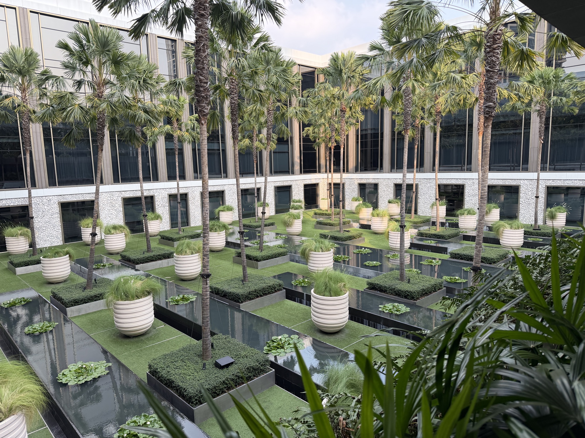 Palm court with grid of planters seen from above at Four Seasons Hotel Bangkok at Chao Phraya River