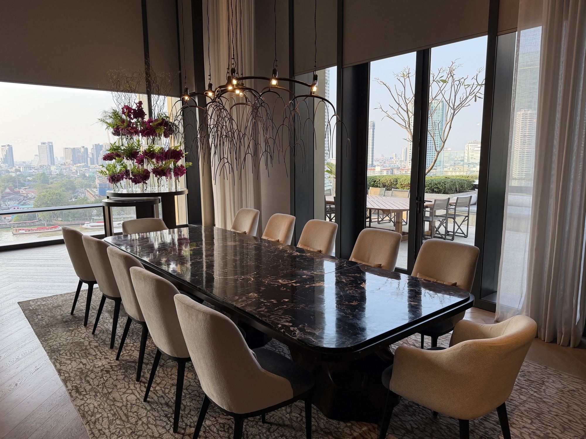 Dining room opening toward the terrace in the Riverfront Penthouse at Four Seasons Hotel Bangkok at Chao Phraya River