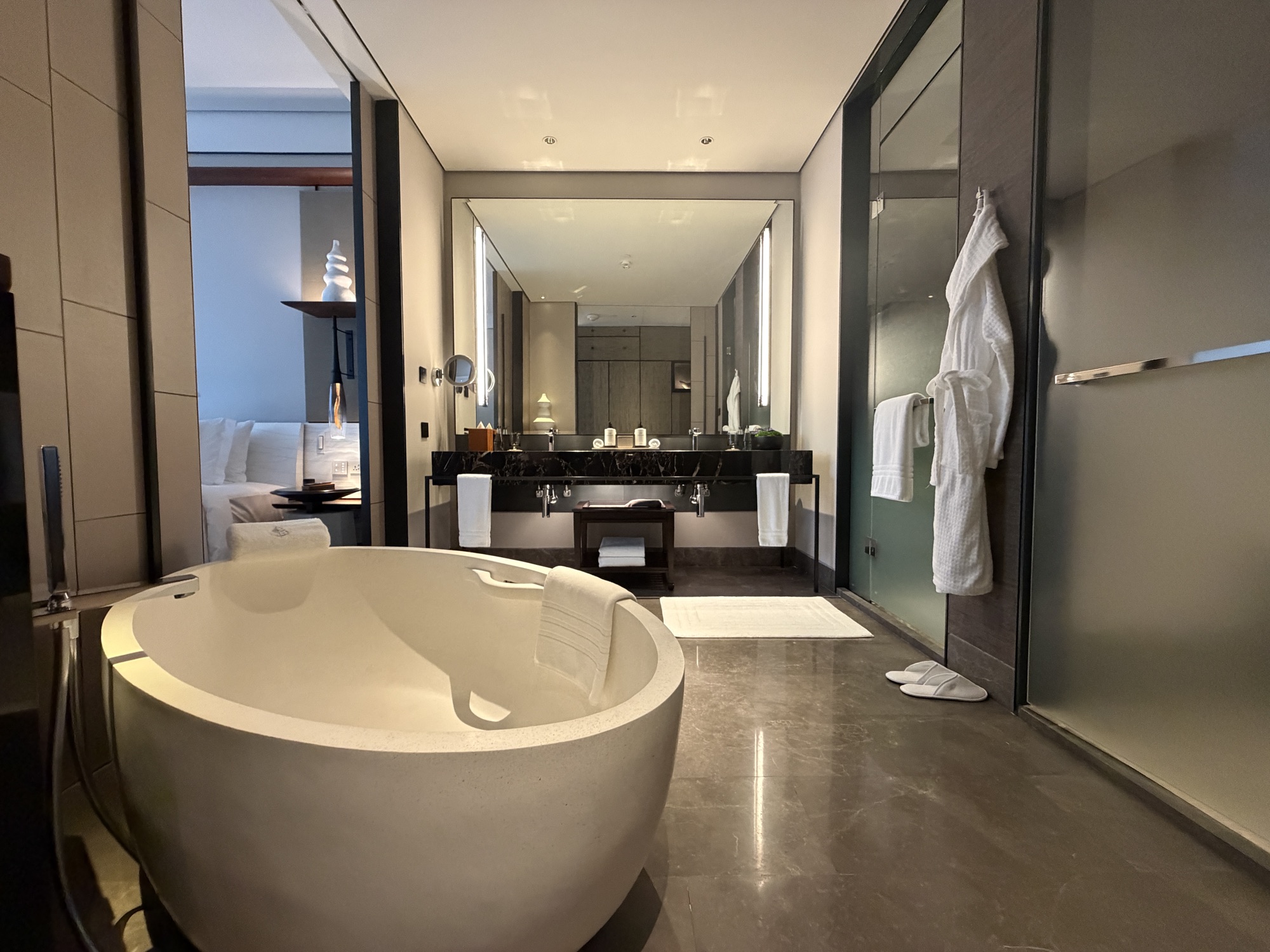 Riverfront Penthouse guest bedroom and bathroom at Four Seasons Hotel Bangkok at Chao Phraya River