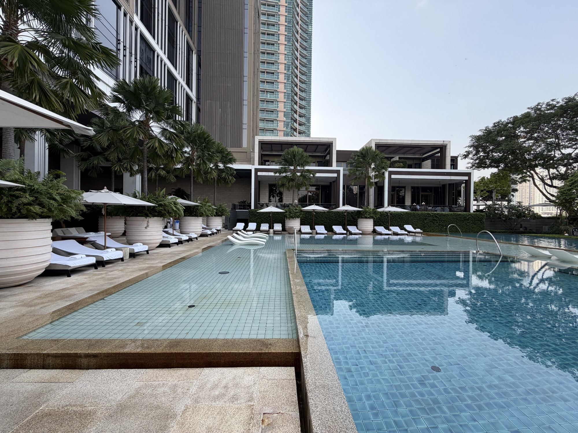 Pool cabanas and umbrellas at Four Seasons Hotel Bangkok at Chao Phraya River