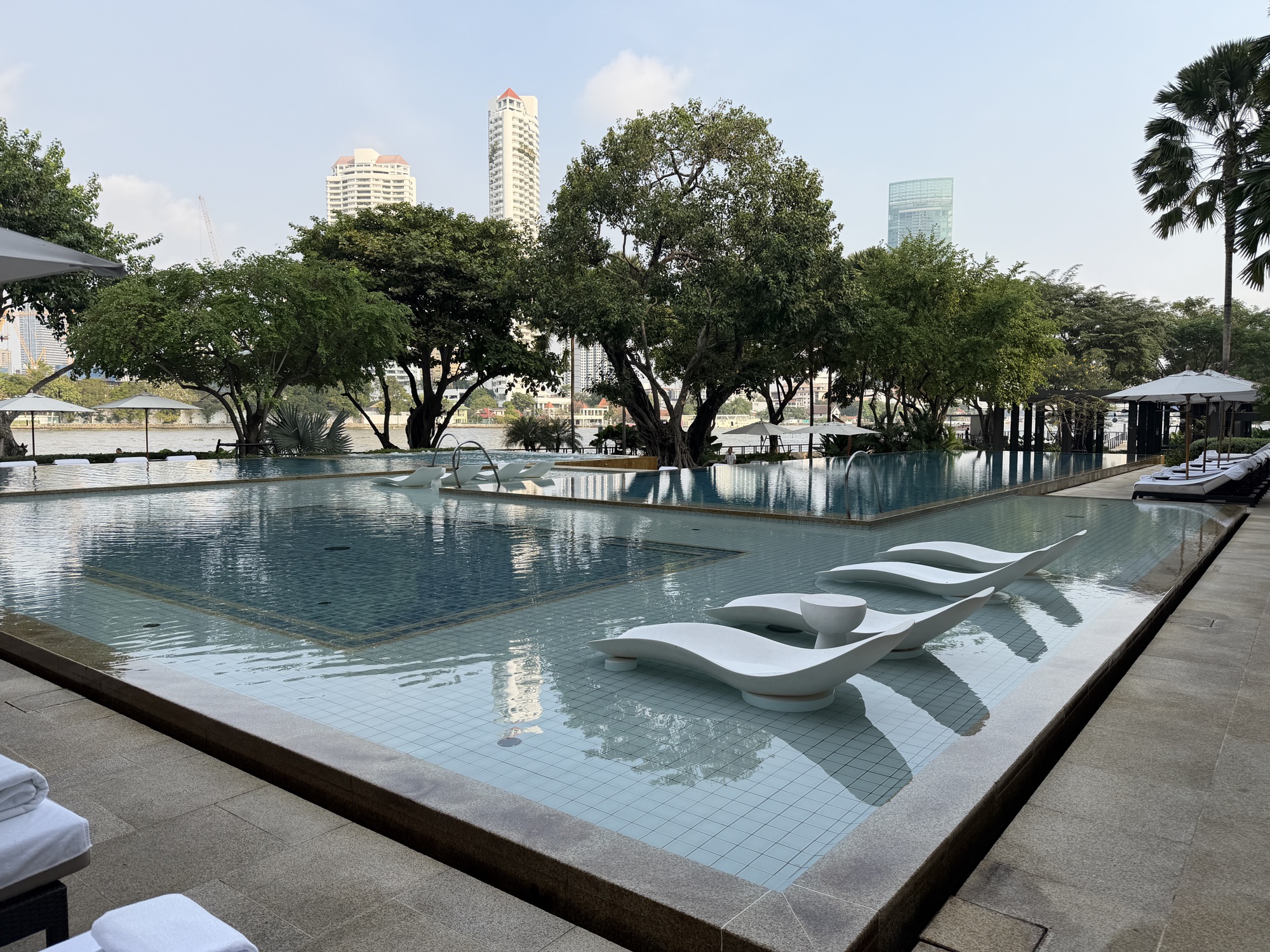 Main pool with in-water loungers at Four Seasons Hotel Bangkok at Chao Phraya River