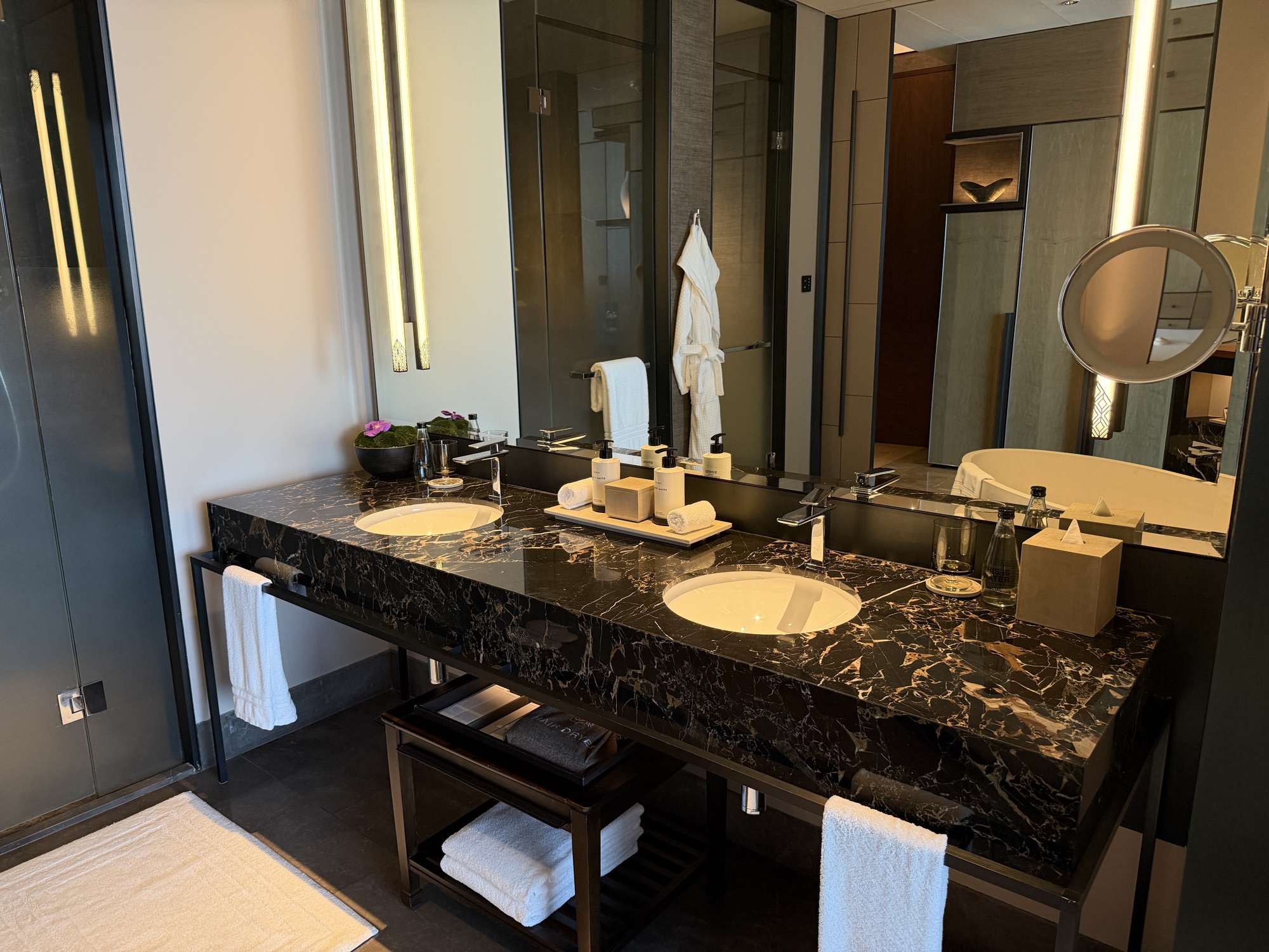 Black marble double vanity in the Deluxe River-View Room bathroom at Four Seasons Hotel Bangkok at Chao Phraya River