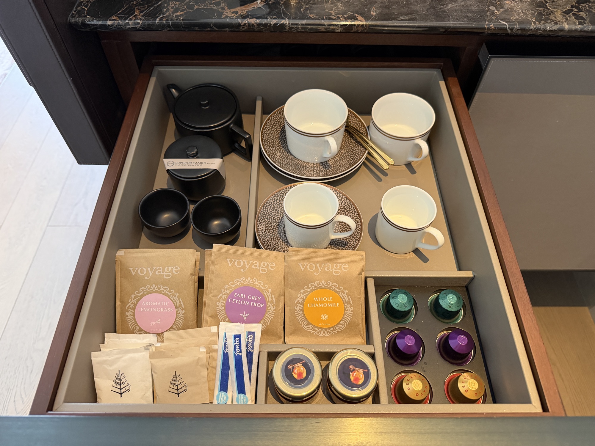 Coffee and tea drawer with Nespresso capsules in the Deluxe River-View Room at Four Seasons Hotel Bangkok at Chao Phraya River