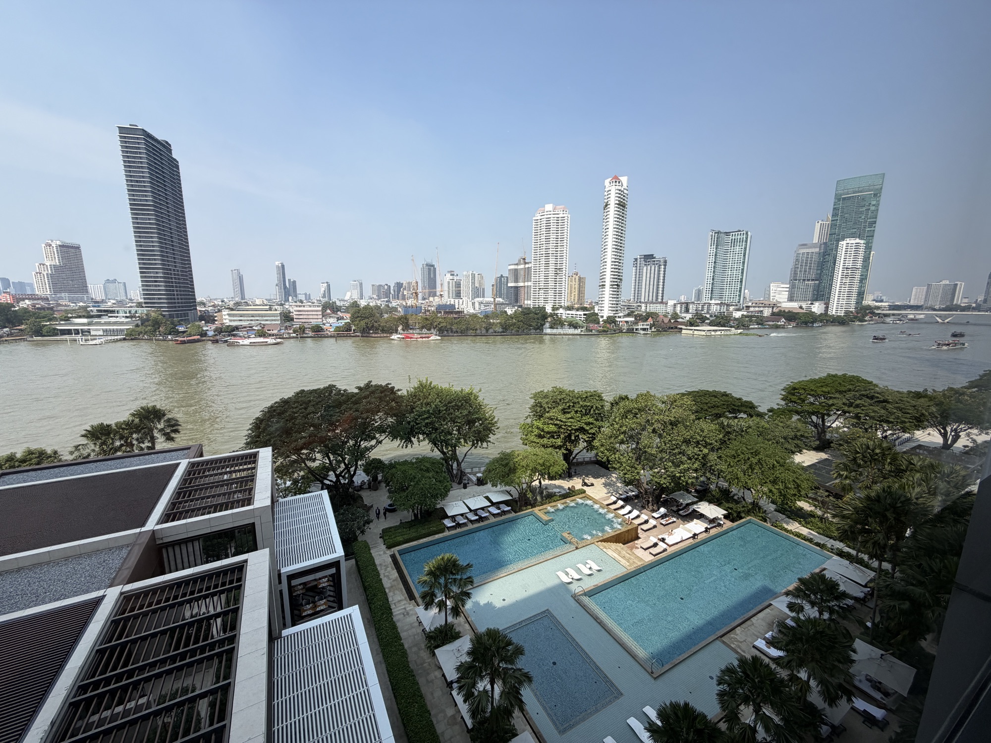 View of the pool and gardens from the Deluxe River-View Room at Four Seasons Hotel Bangkok at Chao Phraya River