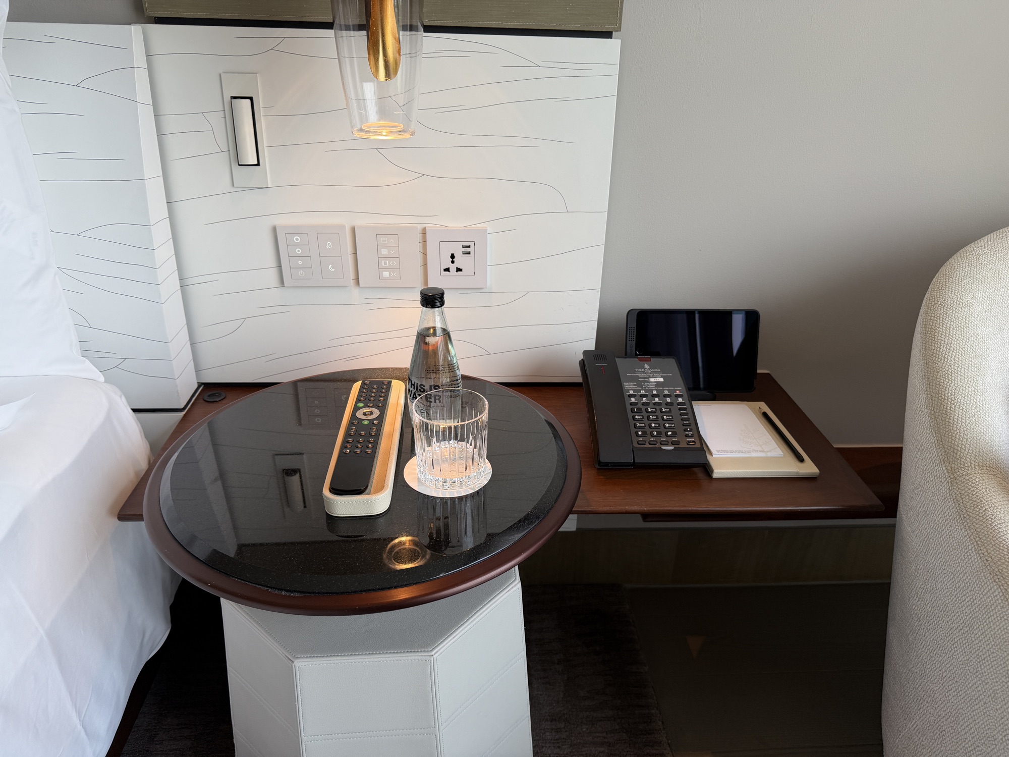 Turndown treat and Bose speaker on the bedside table at Four Seasons Hotel Bangkok at Chao Phraya River