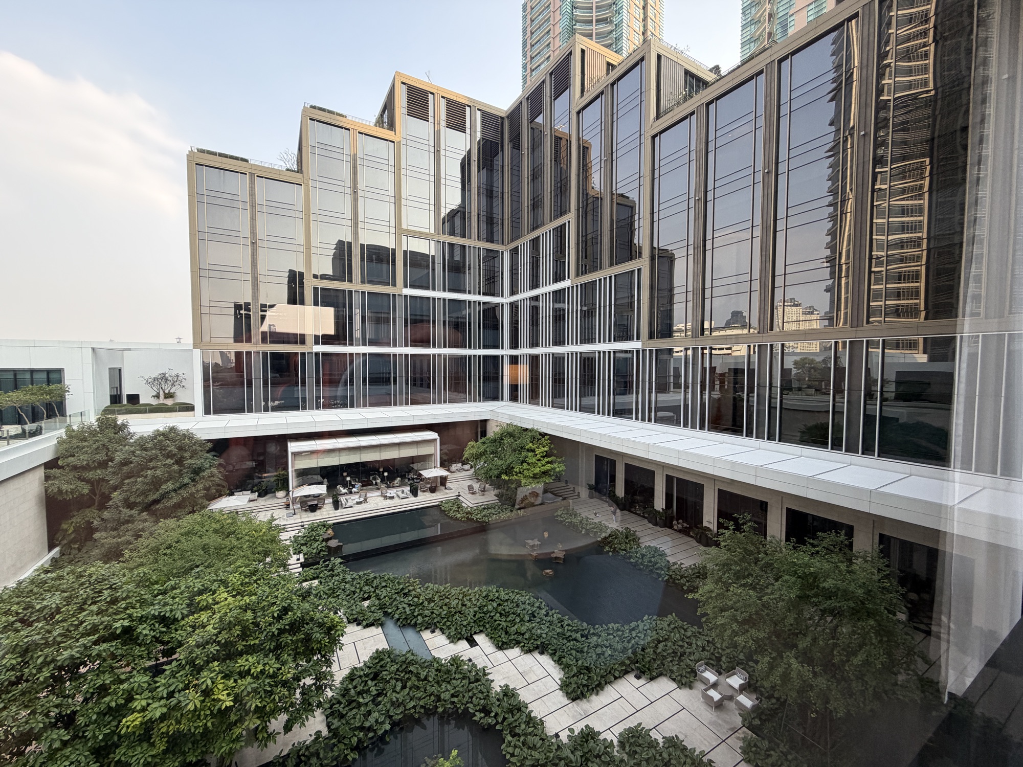 Living areas of the Executive Suite overlooking the estate garden courtyard at Four Seasons Hotel Bangkok at Chao Phraya River