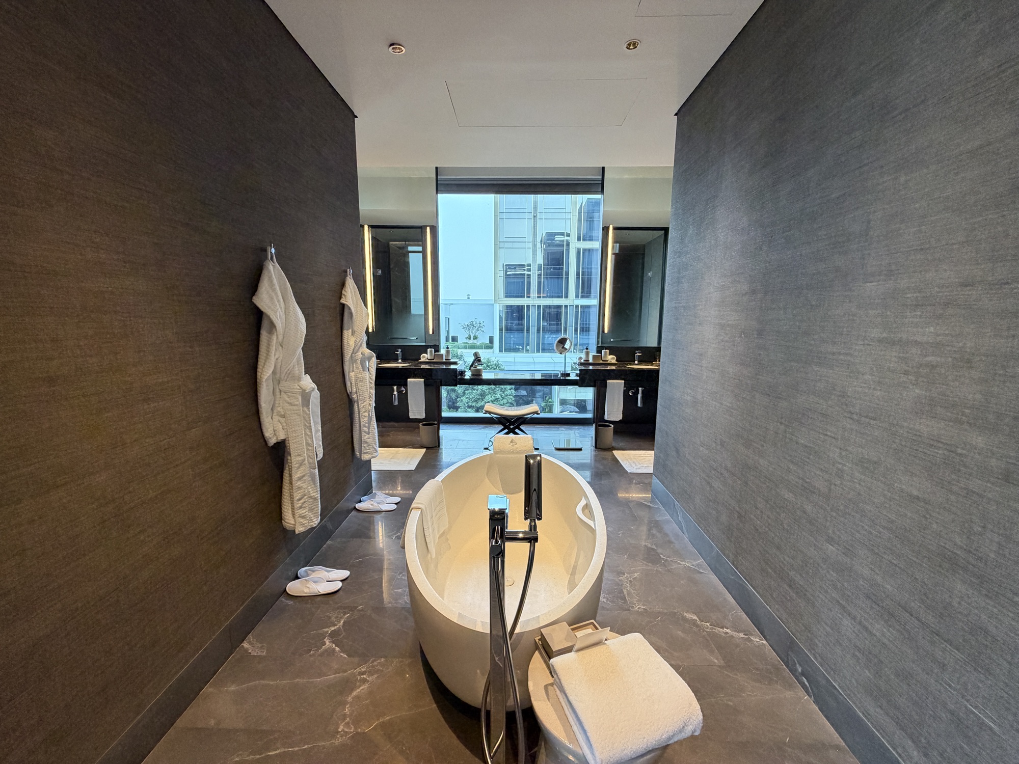 Freestanding tub with robes in the Executive Suite at Four Seasons Hotel Bangkok at Chao Phraya River