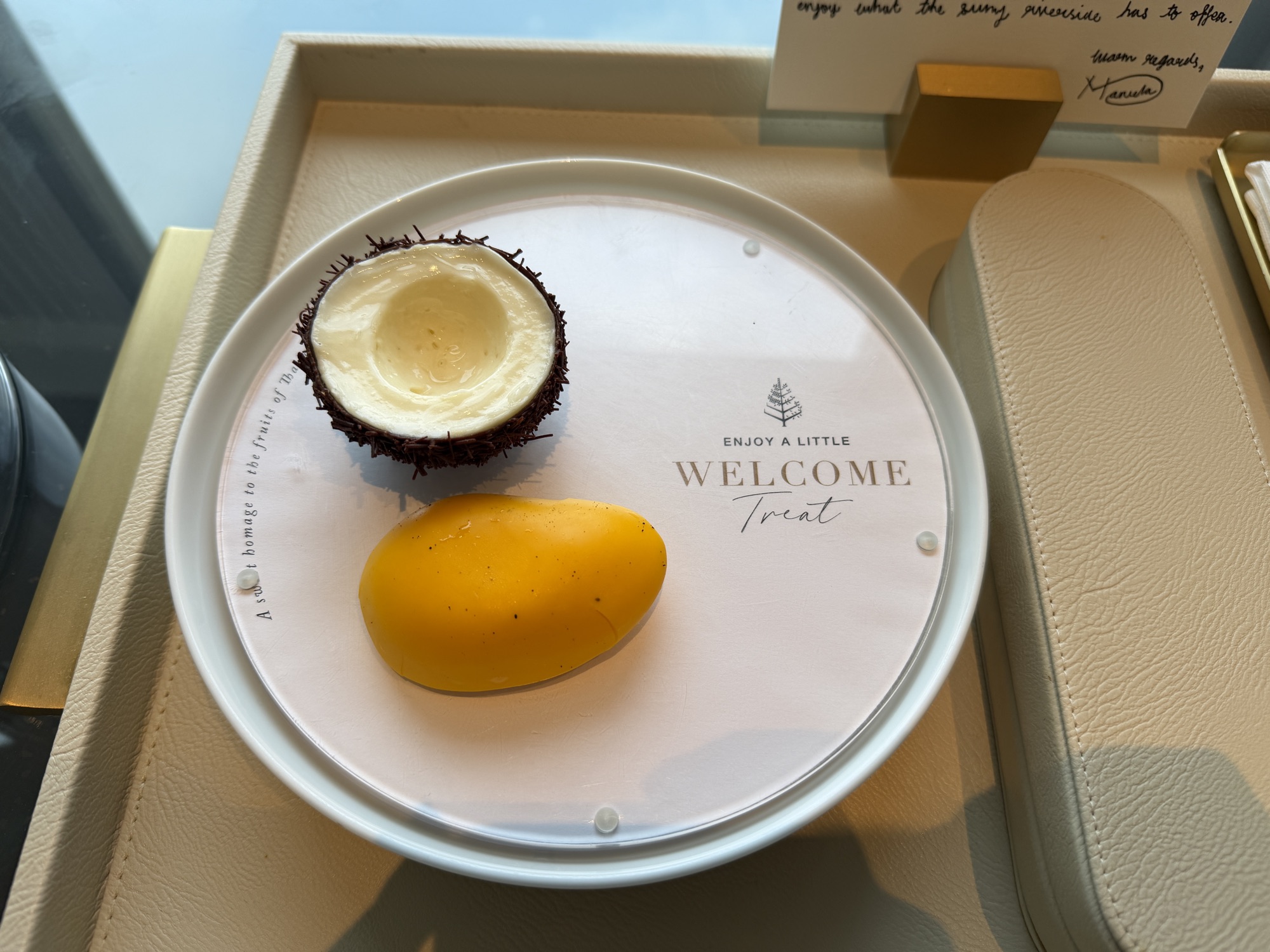 Welcome treat of mango and coconut with handwritten note at Four Seasons Hotel Bangkok at Chao Phraya River