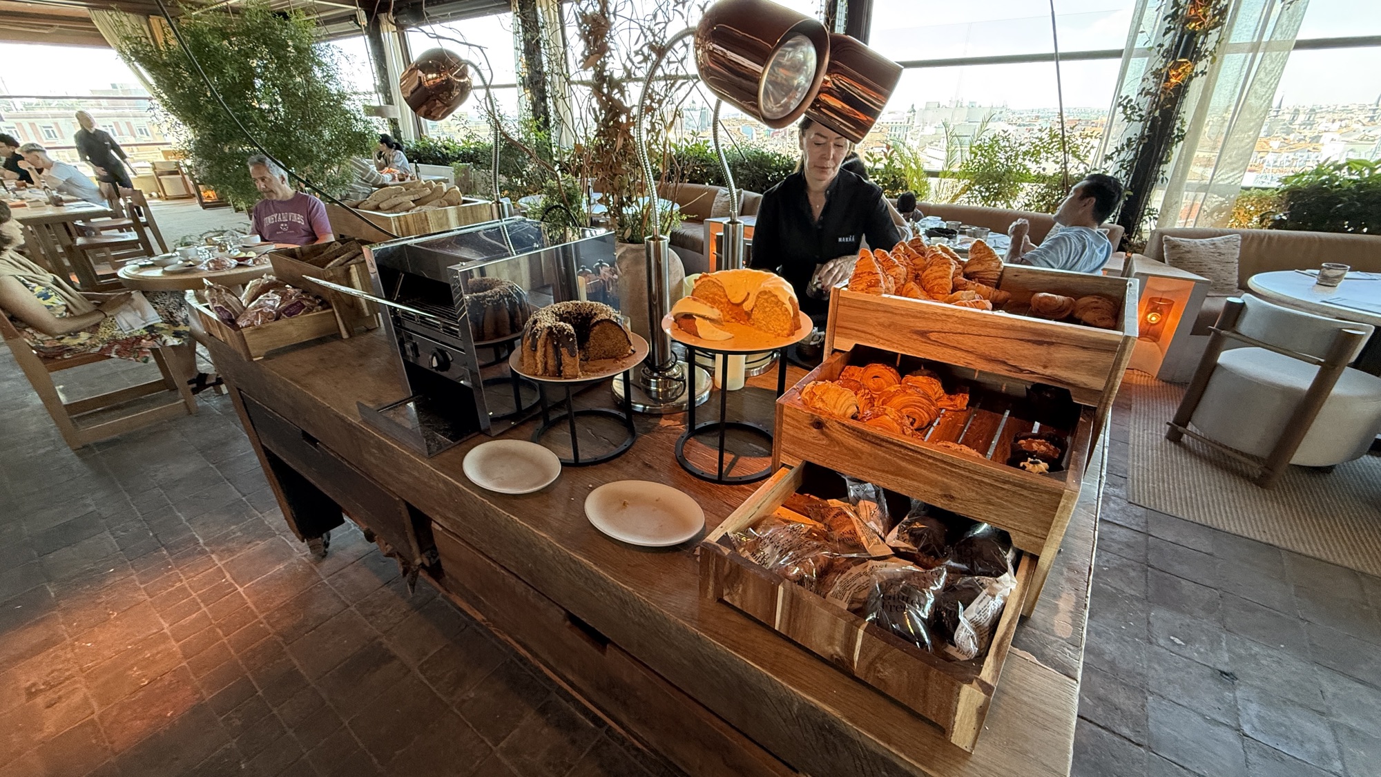 Breakfast bakery station with breads and fresh oranges
