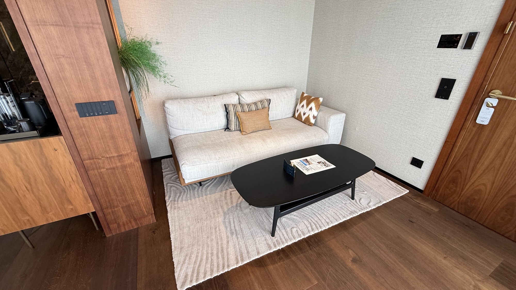Junior Suite living area with a white sofa and coffee table