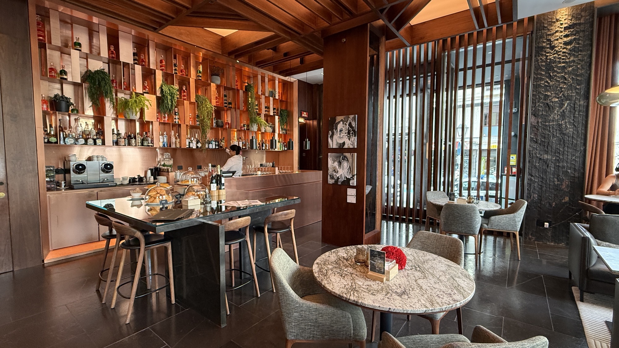 Lobby Bar counter with bottles and greenery