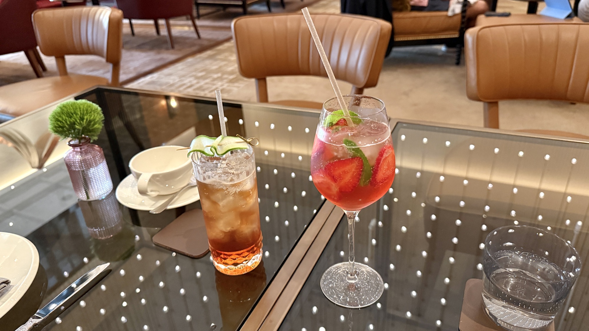 Two cocktails on an illuminated table at the Nine Elms Lounge and Bar