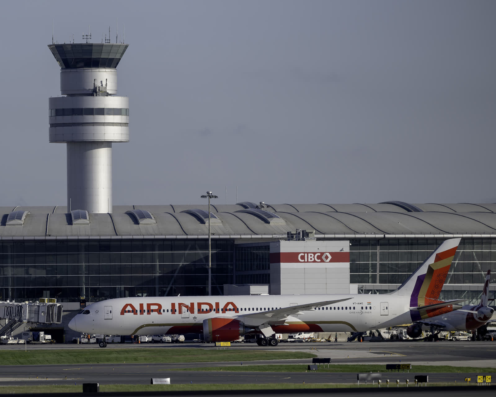 Air India Boeing 787-9 in the new livery in front of Terminal 1 and the control tower at Toronto Pearson