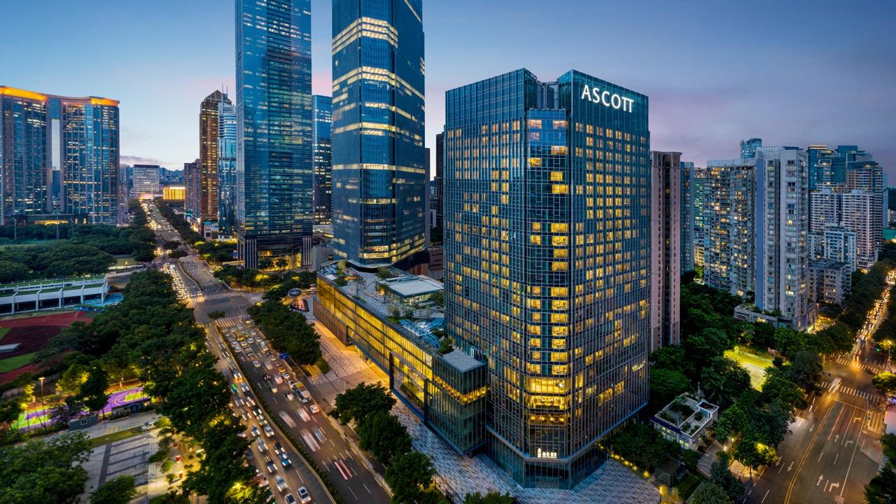 Ascott ICC Guangzhou tower at dusk with the Ascott sign lit against the Guangzhou skyline