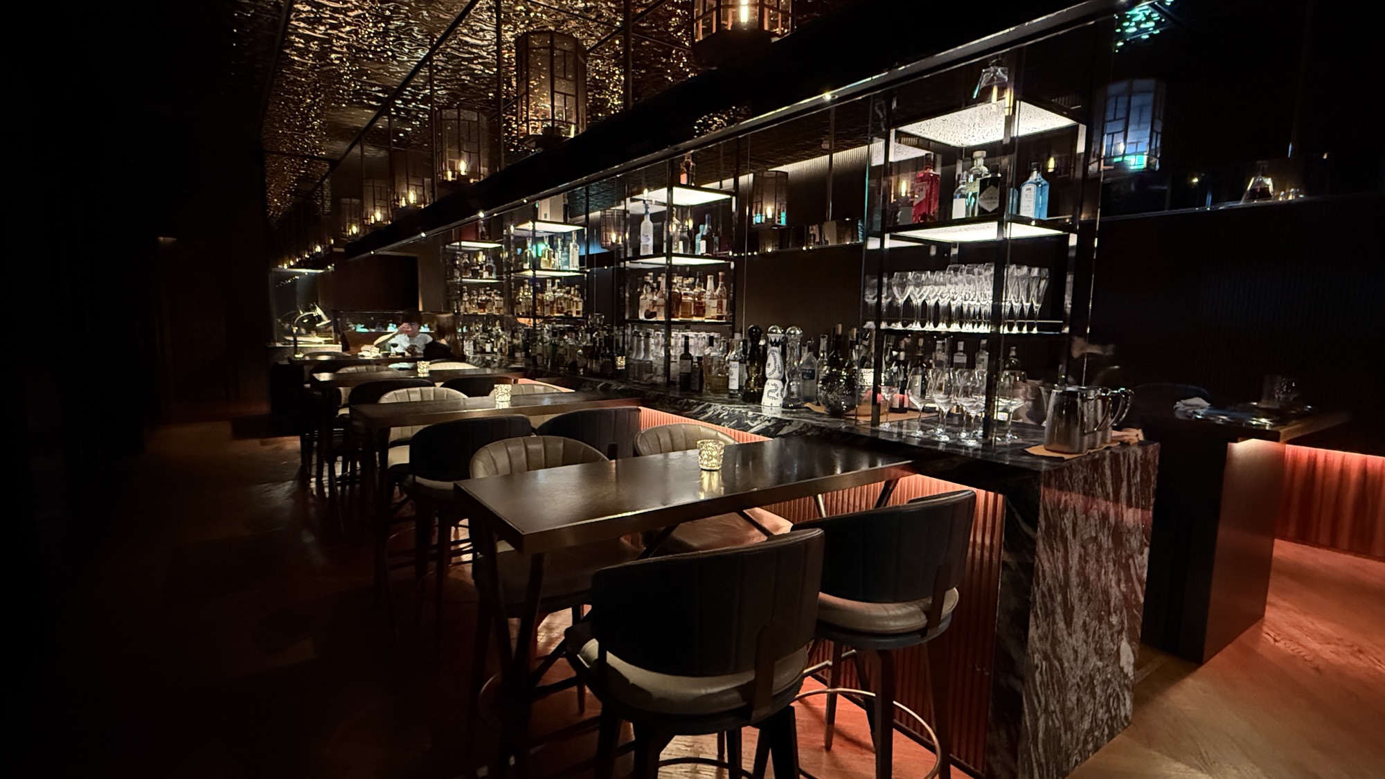 The back bar and counter seating at Bay Bar