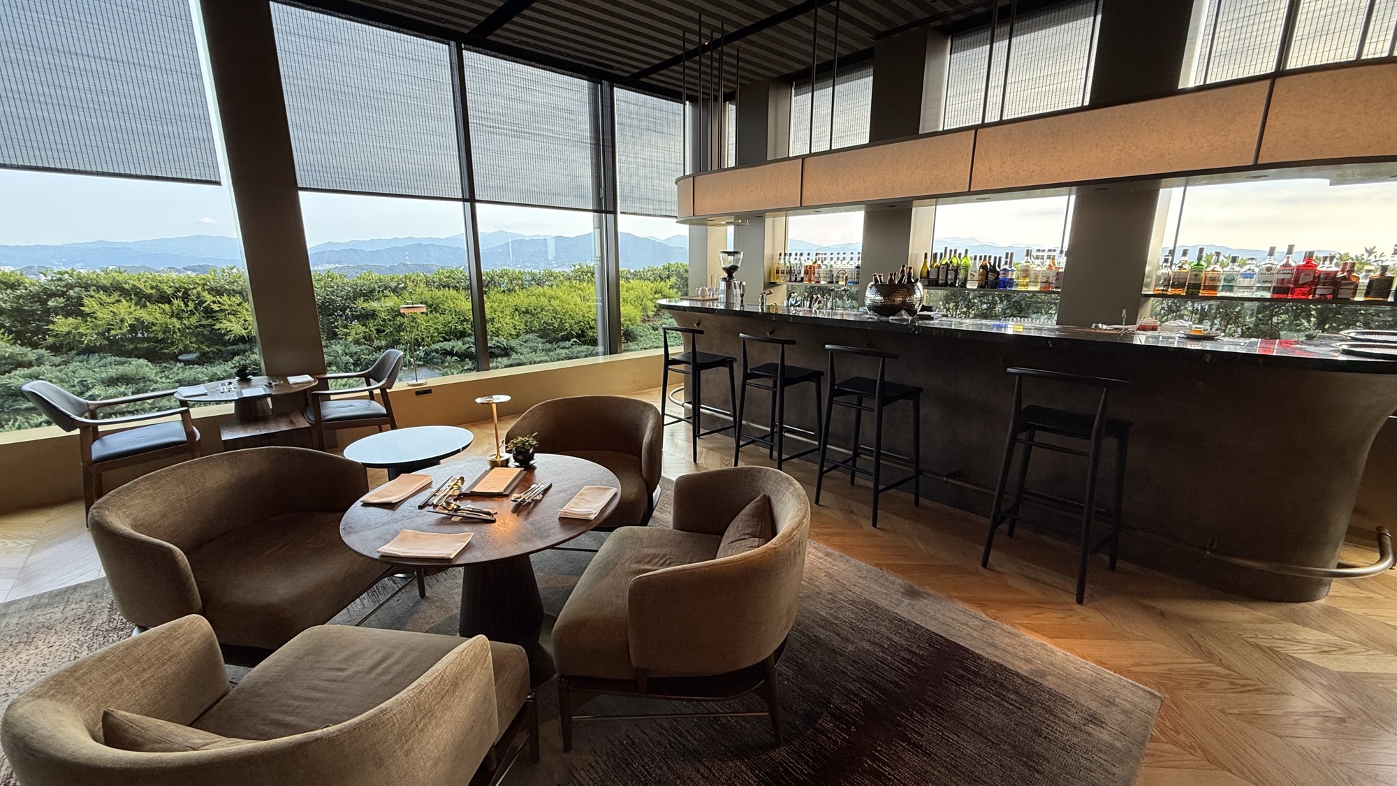 Armchairs and the bar counter in the Club Lounge