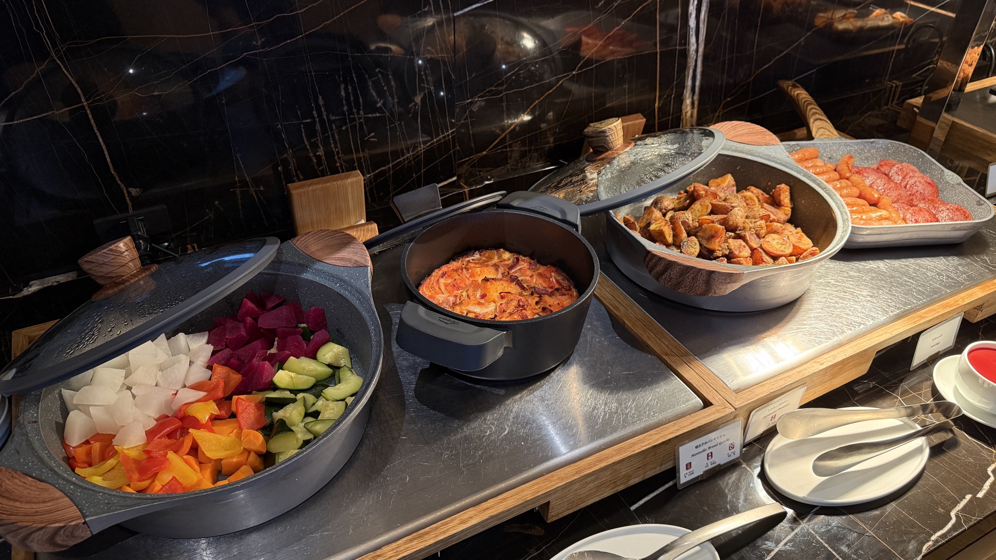 Hot dishes and cut fruit at Club Lounge breakfast