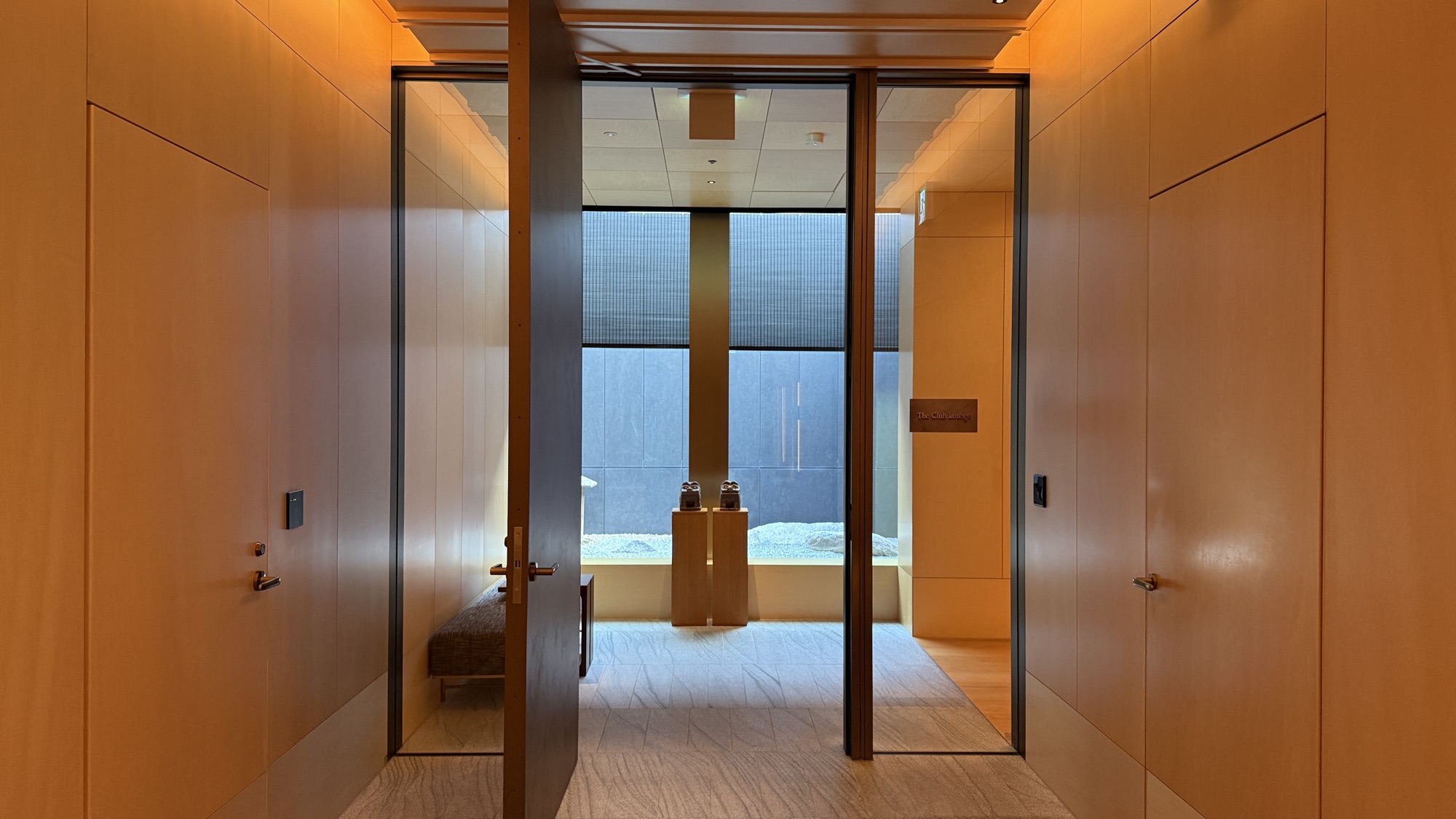 Glazed entrance doors to The Ritz-Carlton Club on the top floor