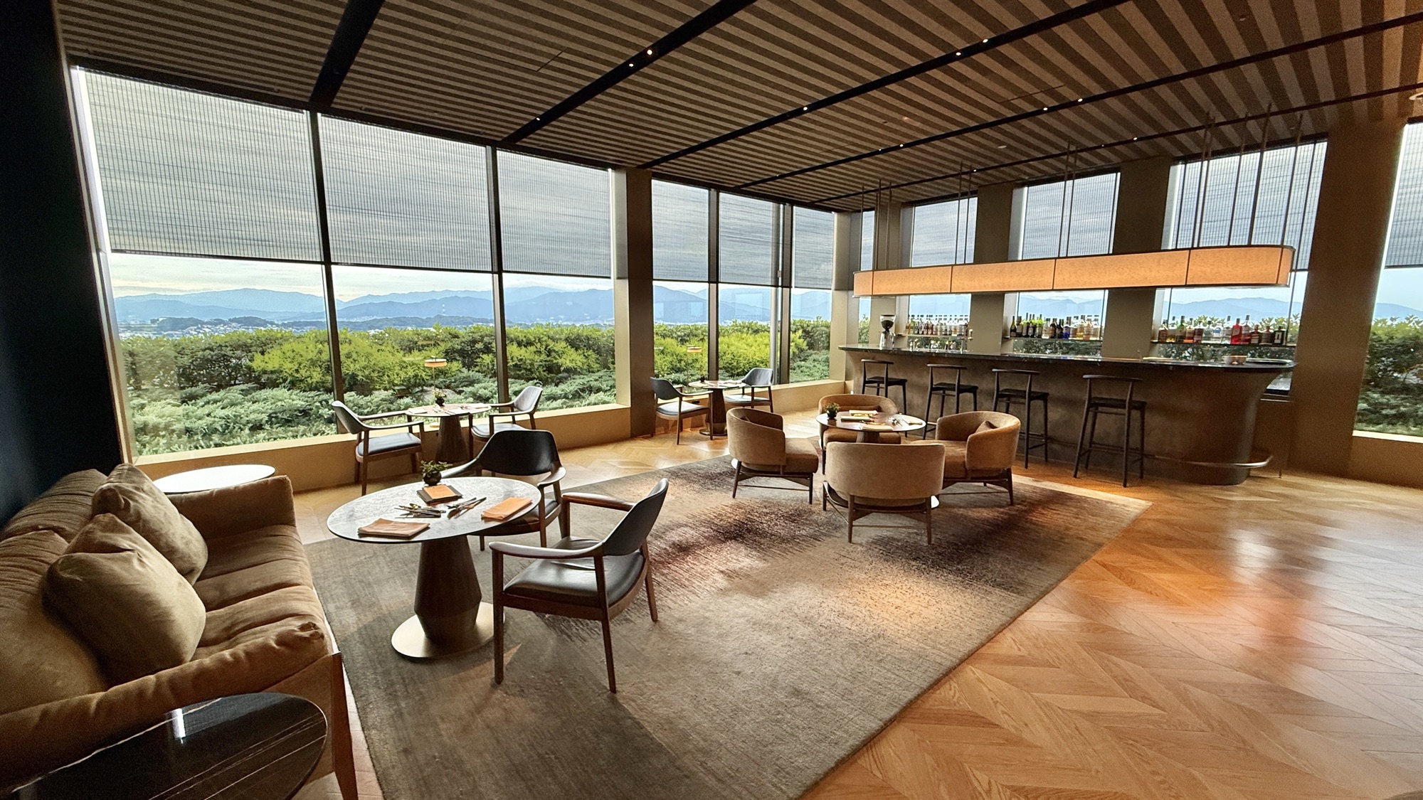 Wide view of the Club Lounge with the bar and lounge seating