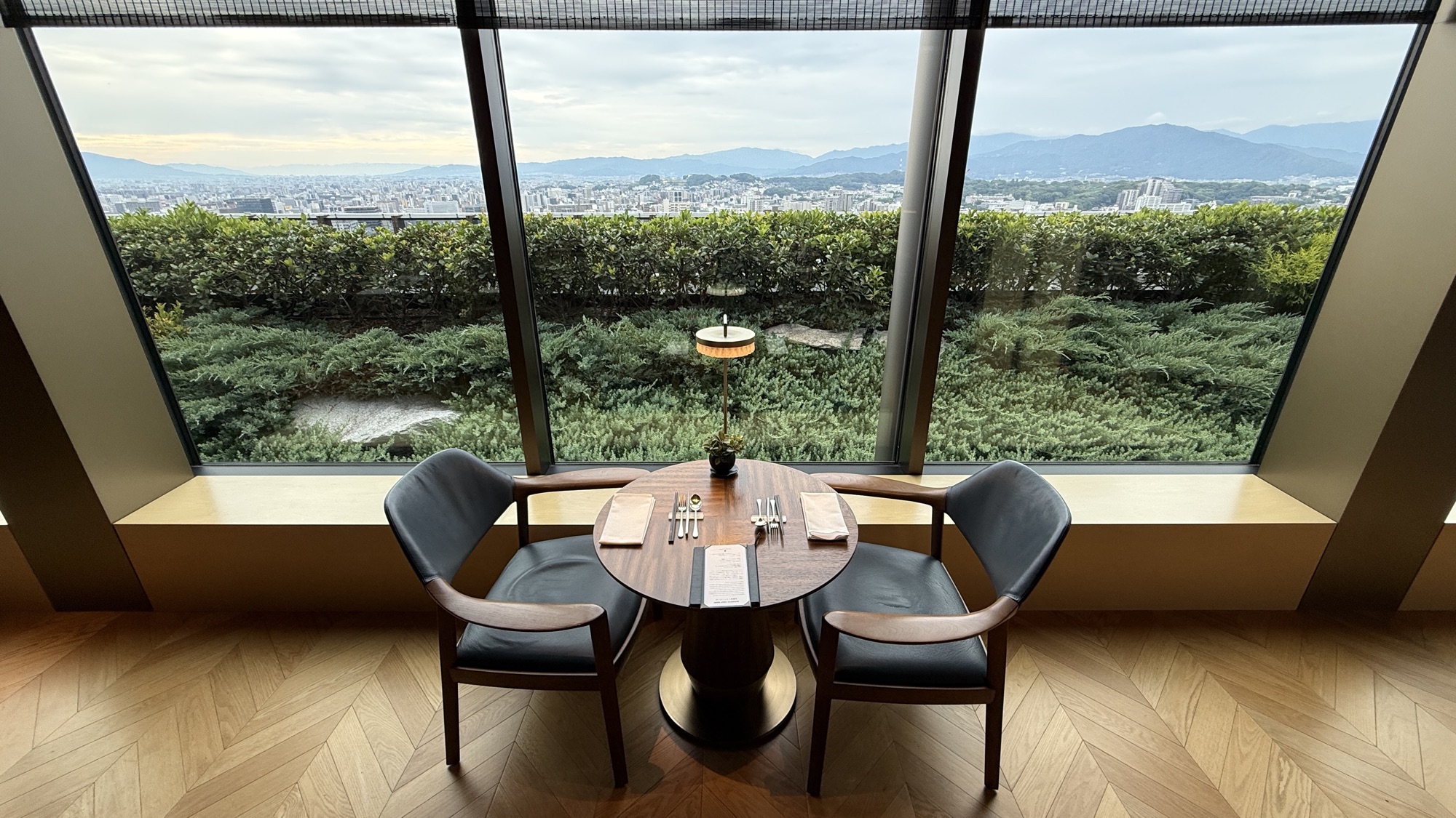 Window table for two with a panoramic view over the city