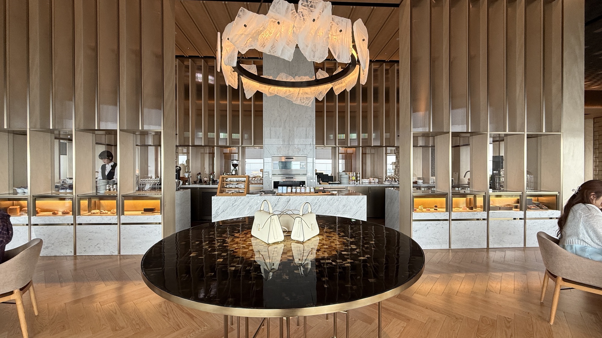 The jewellery inspired interior of Café Diva with its sculptural chandelier