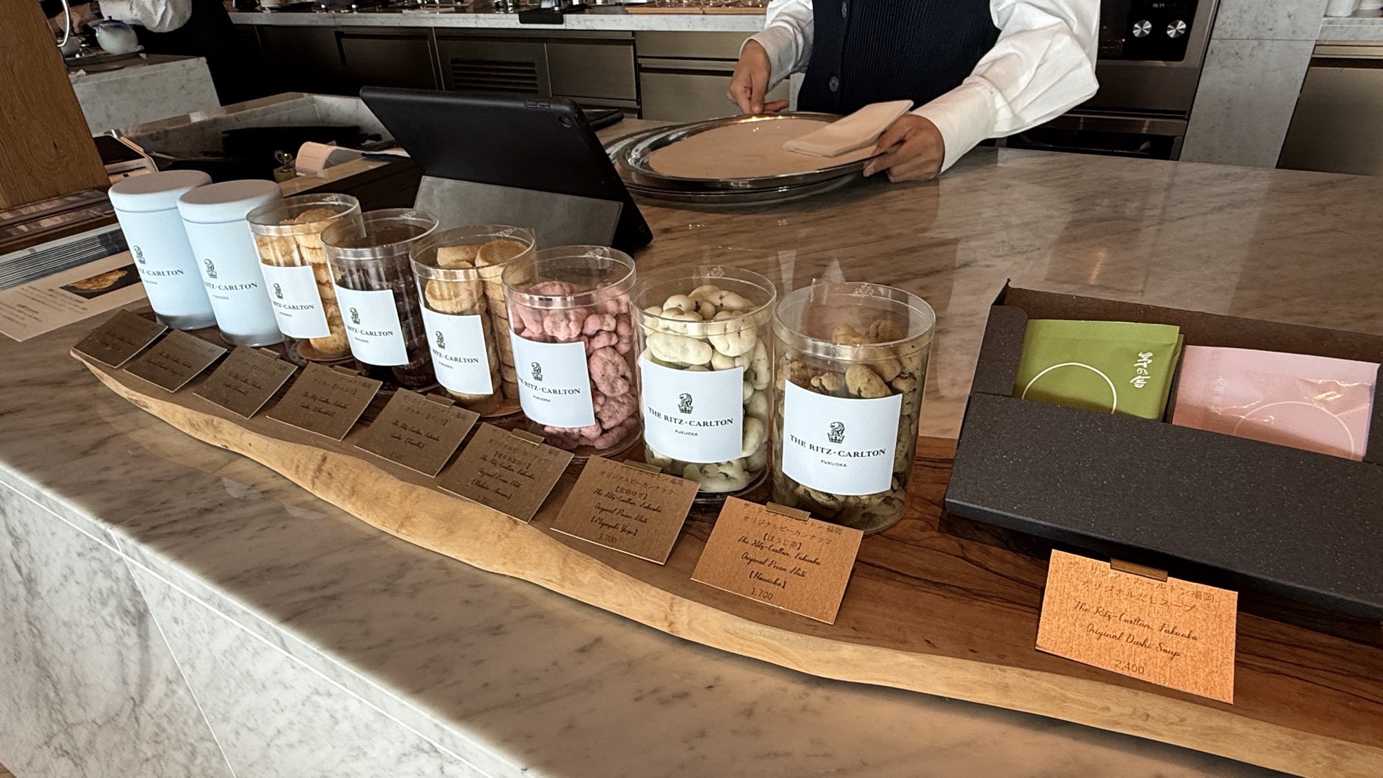 Retail counter at Café Diva with confections in glass jars and gift boxes