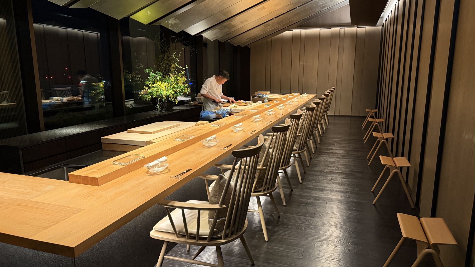The sushi counter at Genjyu with a chef at work