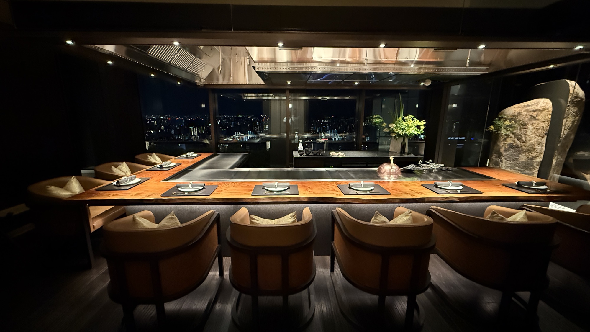 The teppanyaki counter at Genjyu with night views over the city
