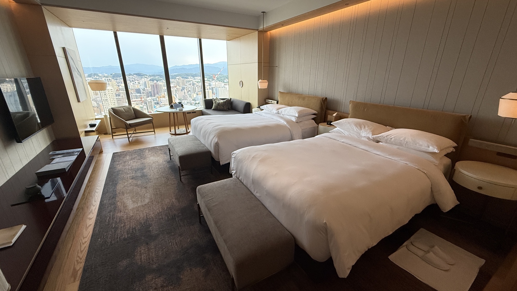The connecting room laid out with two double beds