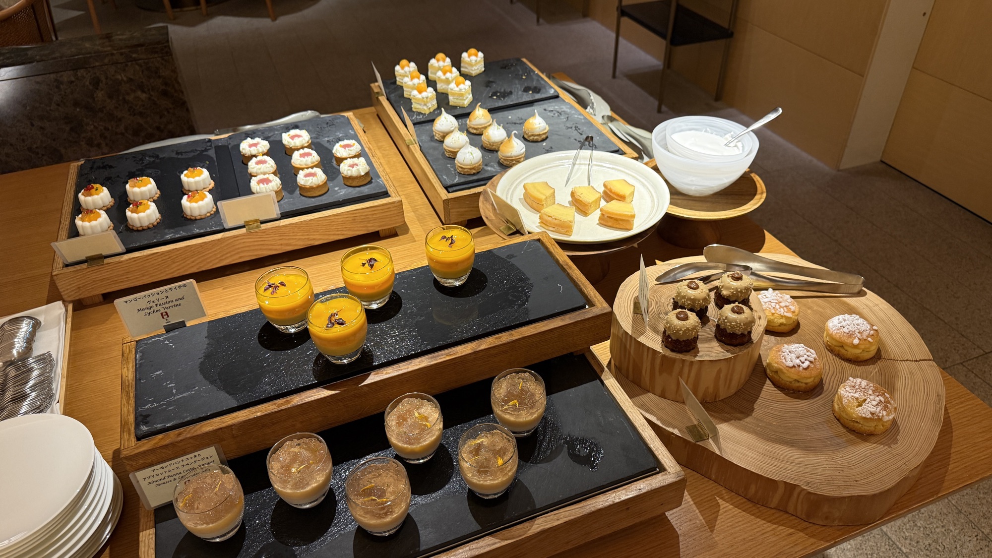 Dessert station with tarts, mousse cups and petit fours