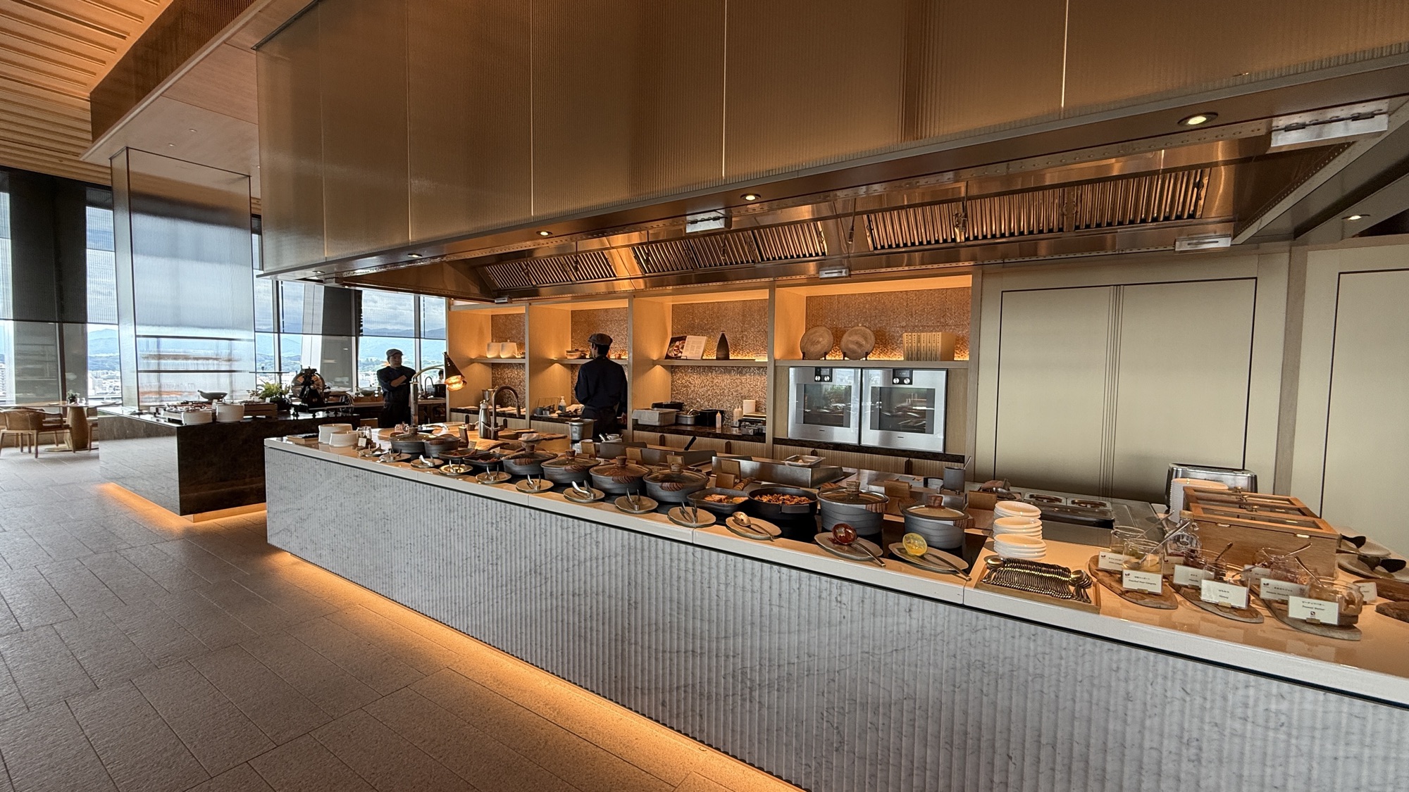 Open kitchen and buffet counter at Viridis with chefs at work