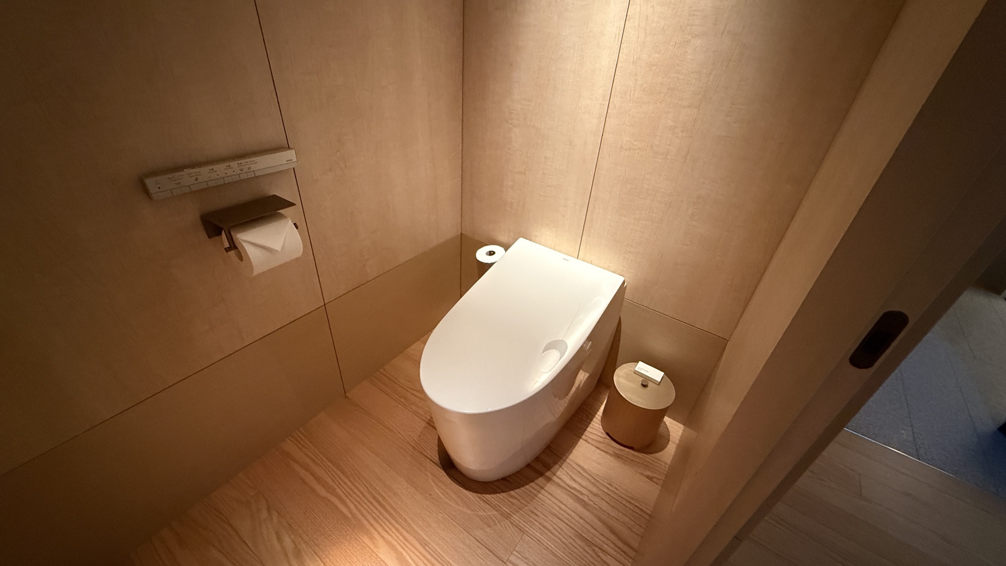 Separate water closet with wood panelling