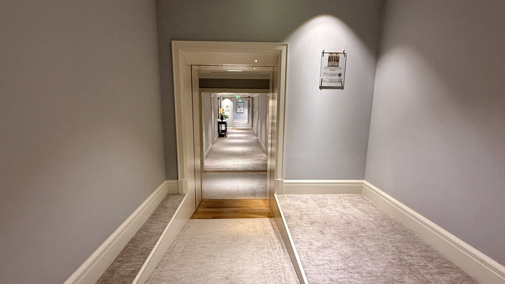 Corridor connecting two of the residential palaces, with a plaque giving historical context