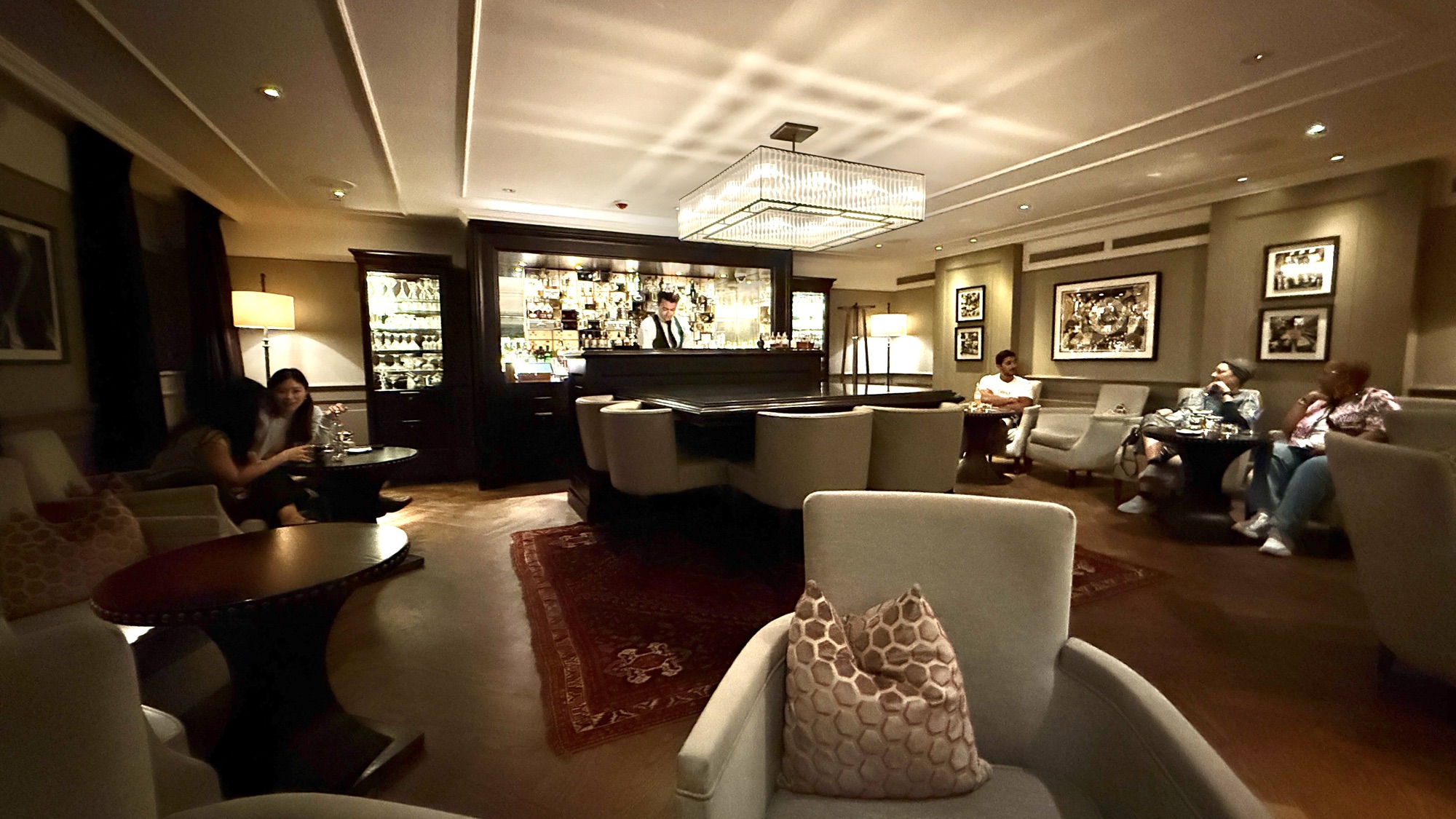The Vault Bar lounge with armchairs and a patterned rug in the former bank vault