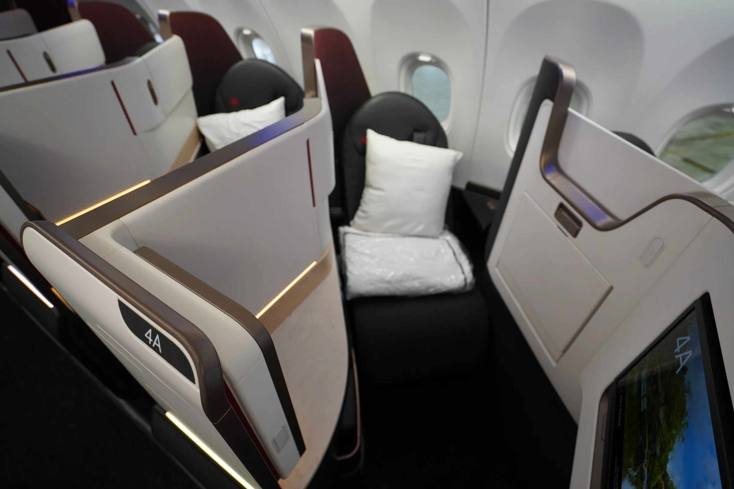 Air Canada Signature Class suite with a pillow and seatback screen on the Airbus A321XLR