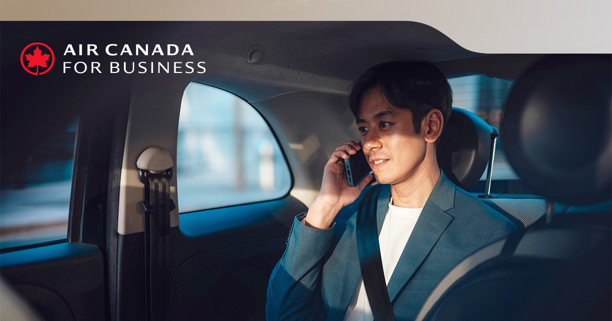 Air Canada for Business image for Air Canada Embarq showing a business traveller on a phone call in the back of a car